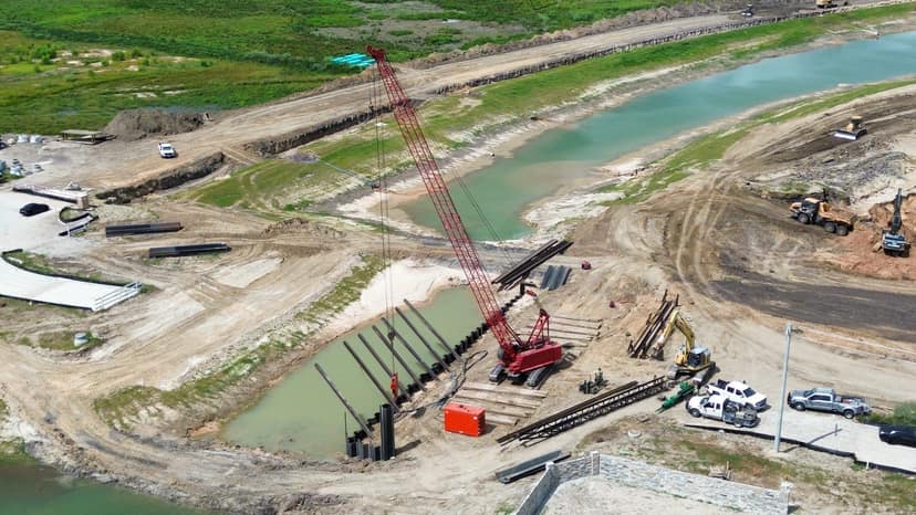Legacy Bridge West — Driving sheet piles along the channel
